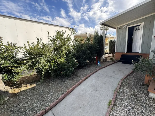 a front view of house with small garden