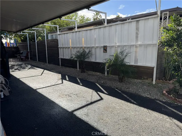 a view of a house with swimming pool and a yard