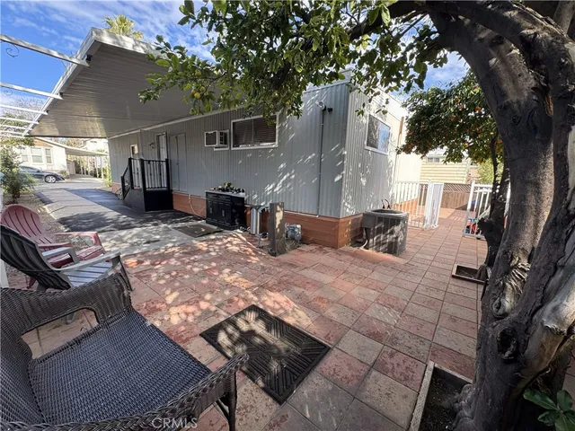 a view of a backyard with sitting area