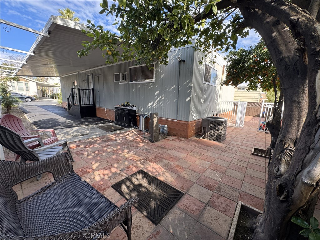 1025 South Riverside Avenue, Unit 66 Rialto, CA 92376 - Photo 7 of 53 a view of a backyard with sitting area
