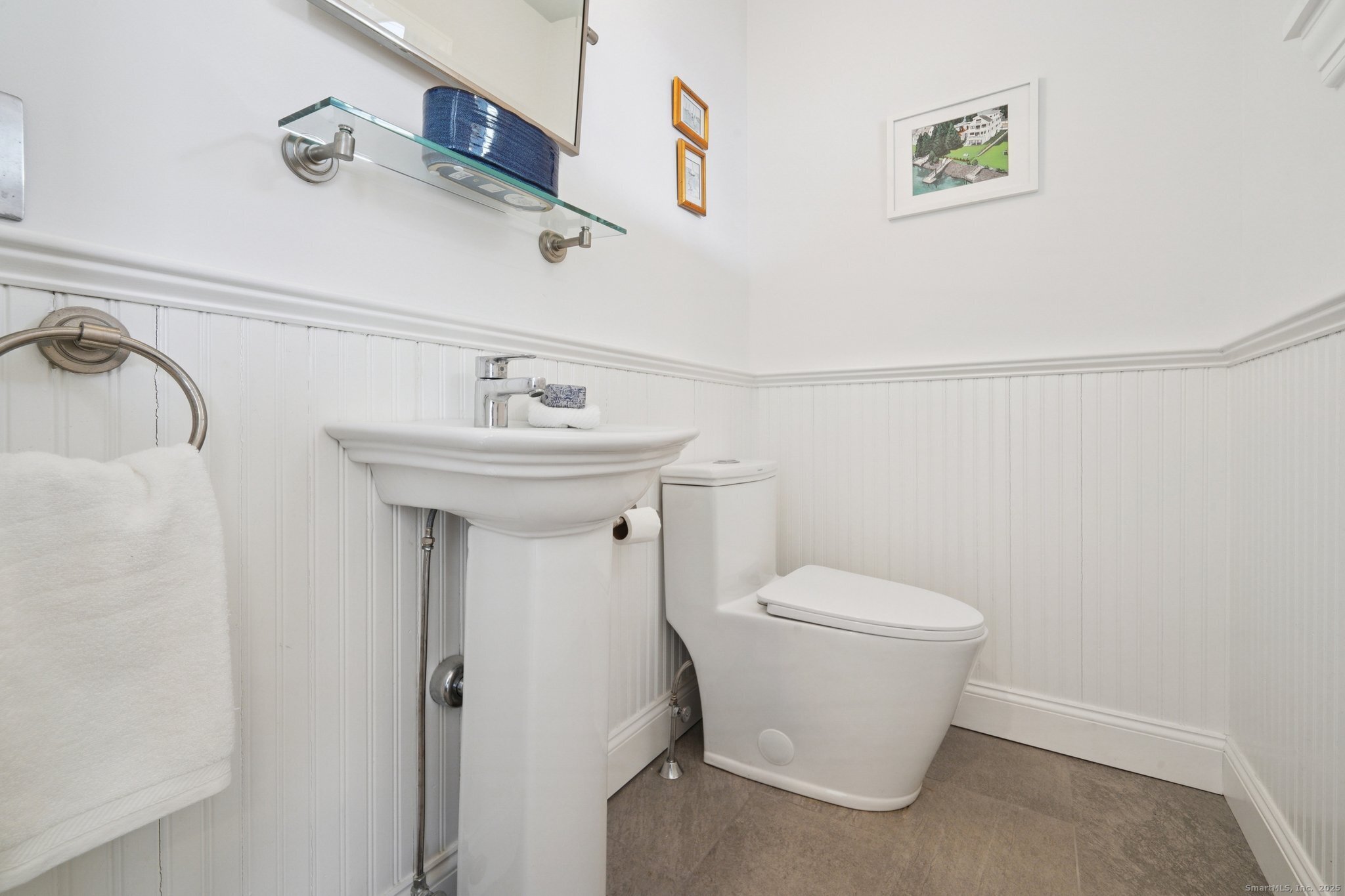 656 Fairfield Beach Road Fairfield, CT 06824 - Photo 13 of 30 a bathroom with a sink and toilet
