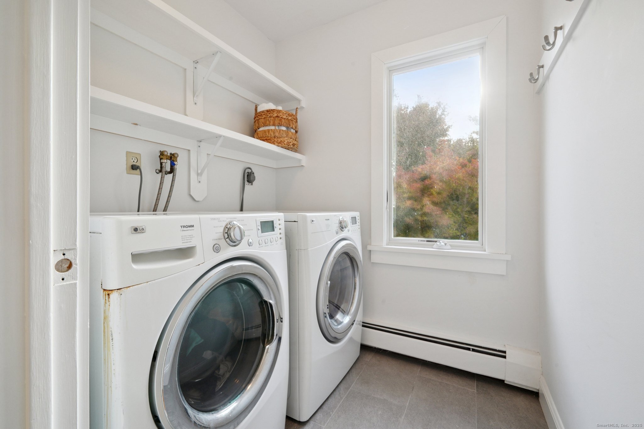 656 Fairfield Beach Road Fairfield, CT 06824 - Photo 14 of 30 a utility room with dryer and washer