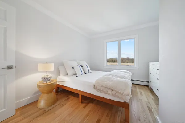 a bathroom with a sink toilet and mirror