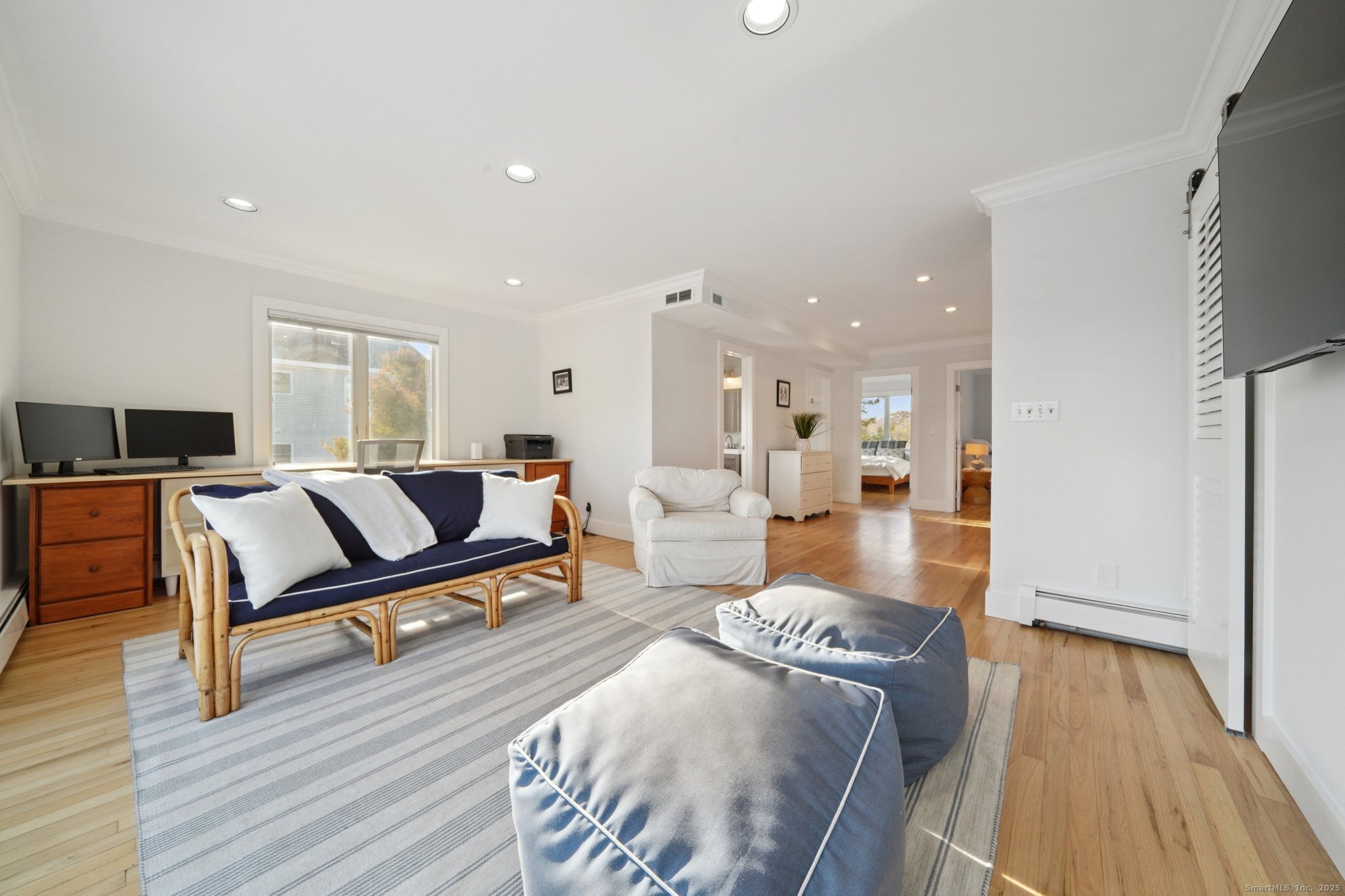 656 Fairfield Beach Road Fairfield, CT 06824 - Photo 18 of 30 a living room with furniture and a wooden floor