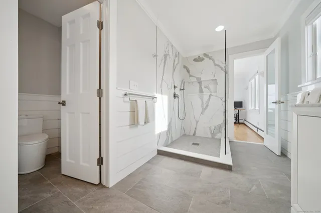 a bathroom with a double vanity sink mirror and