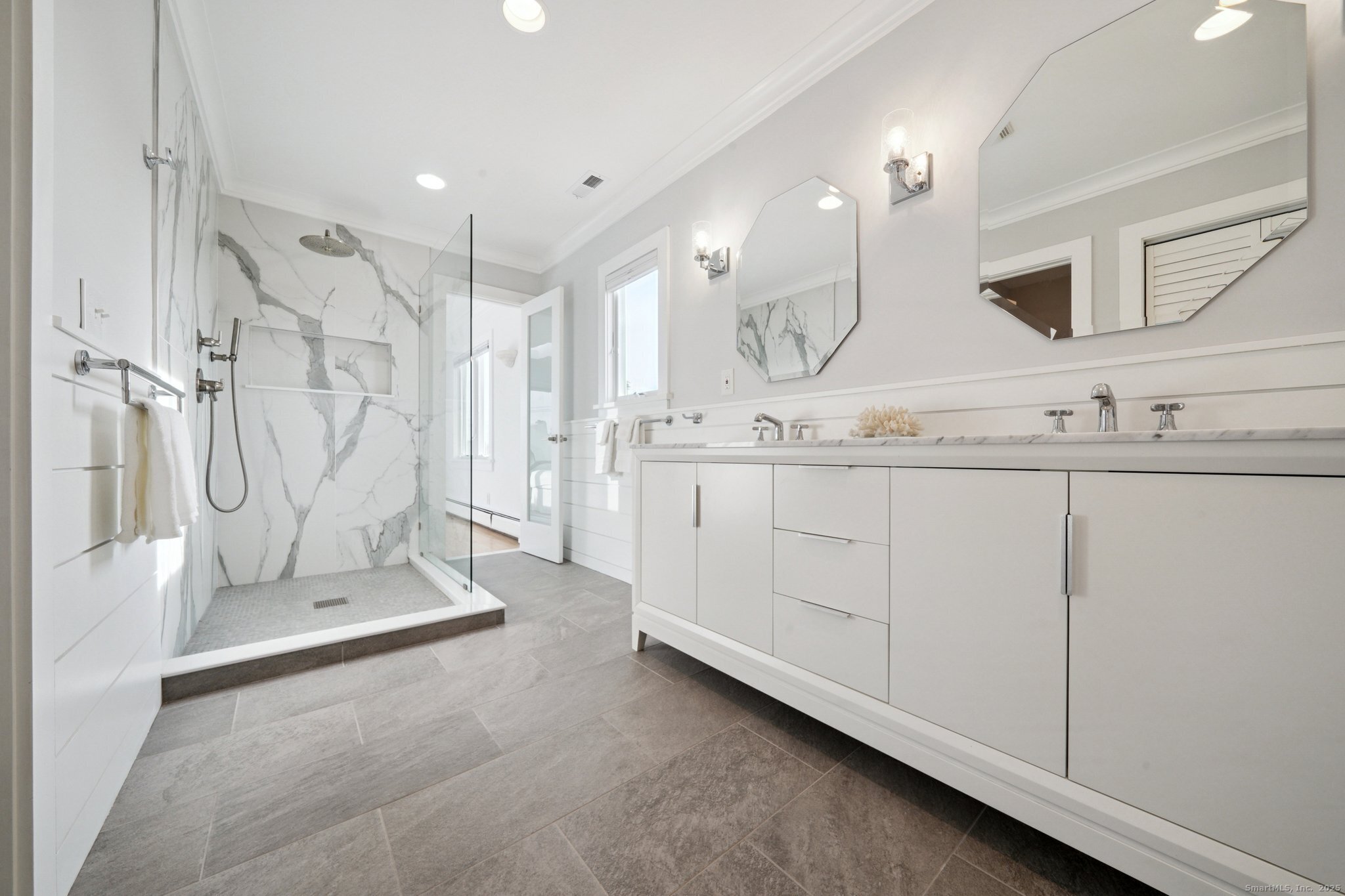 656 Fairfield Beach Road Fairfield, CT 06824 - Photo 25 of 30 a bathroom with a double vanity sink mirror and