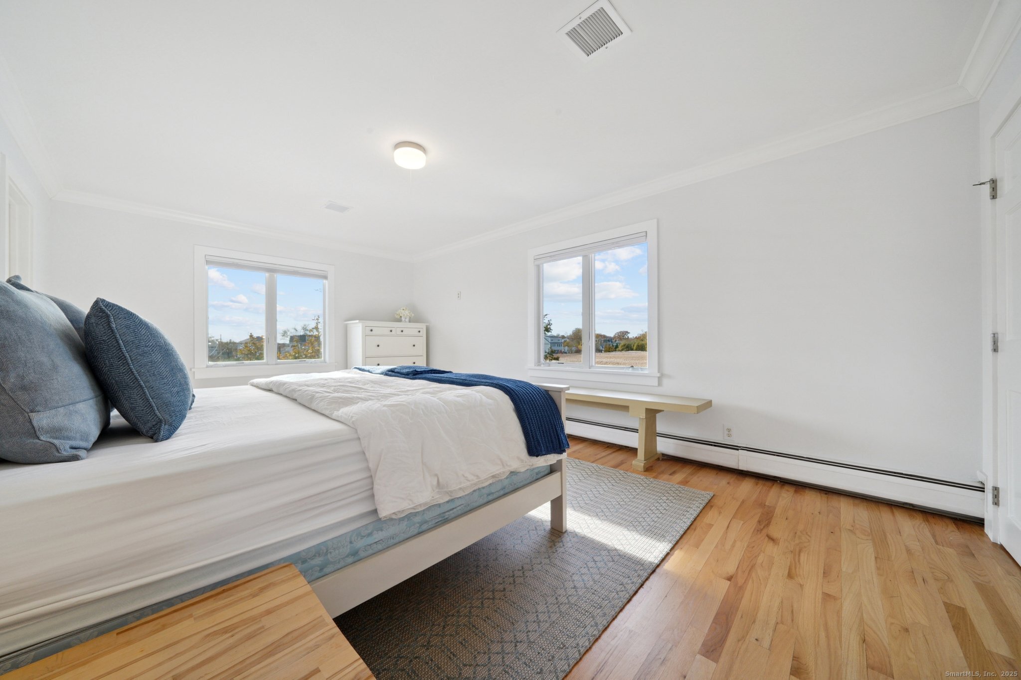 656 Fairfield Beach Road Fairfield, CT 06824 - Photo 27 of 30 a bedroom with a bed and window