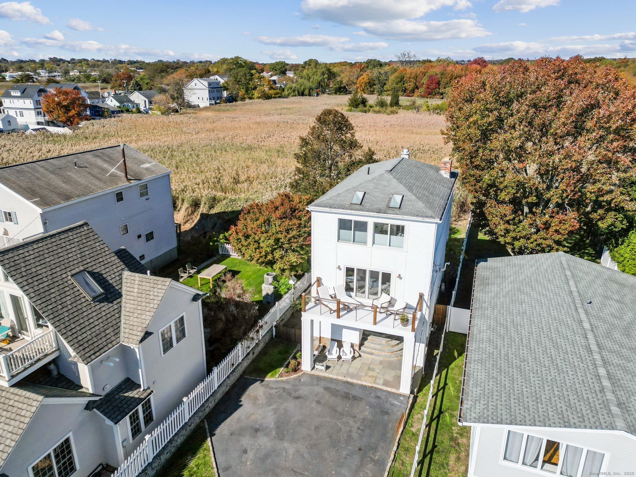 656 Fairfield Beach Road Fairfield, CT 06824 - Photo 3 of 30 an aerial view of a house with a yard