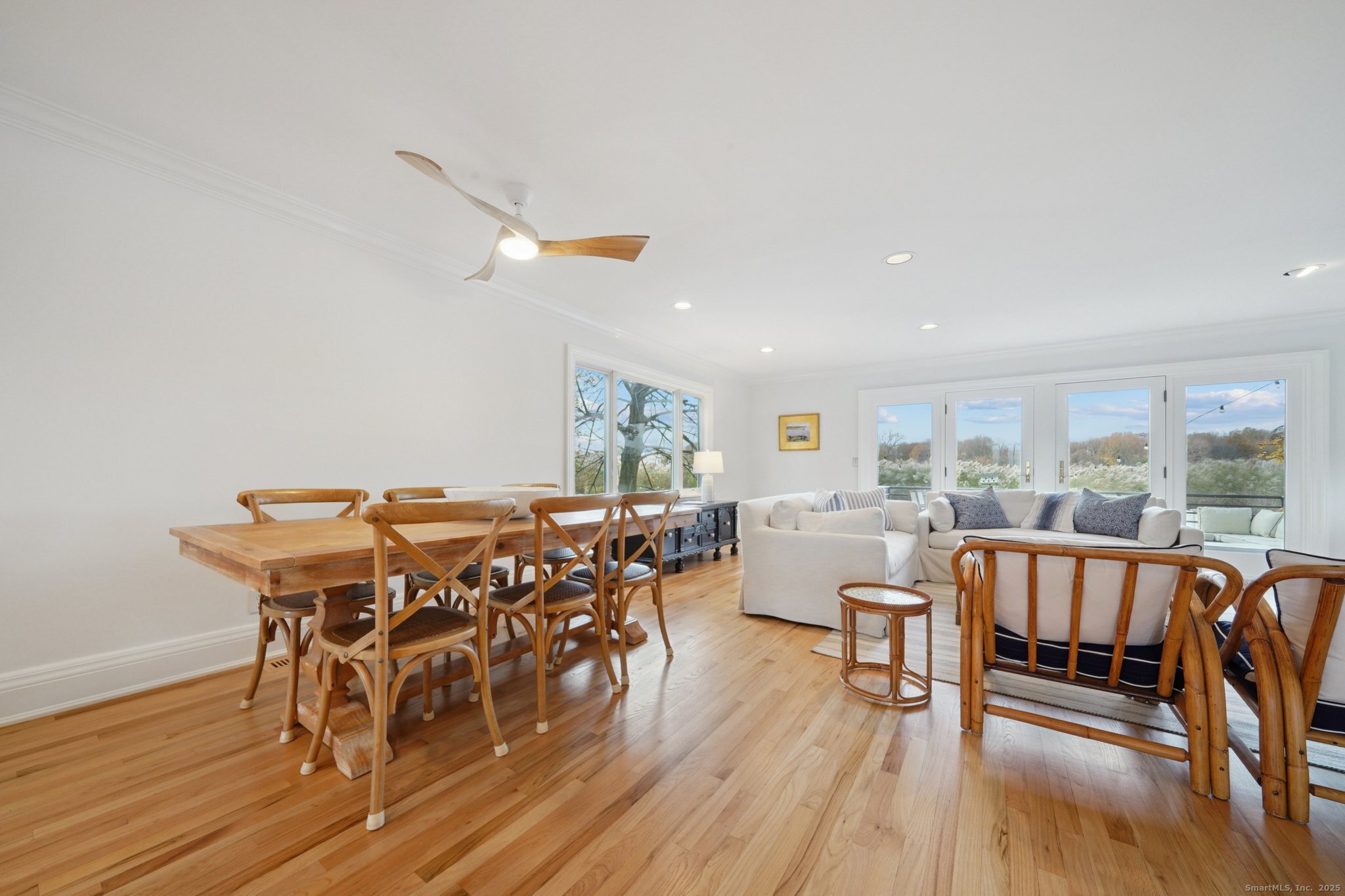 656 Fairfield Beach Road Fairfield, CT 06824 - Photo 8 of 30 a view of a dining room with furniture window and wooden floor
