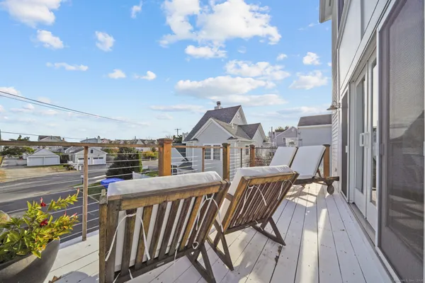a view of balcony with furniture