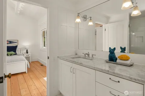 a bathroom with a sink double vanity granite and shower