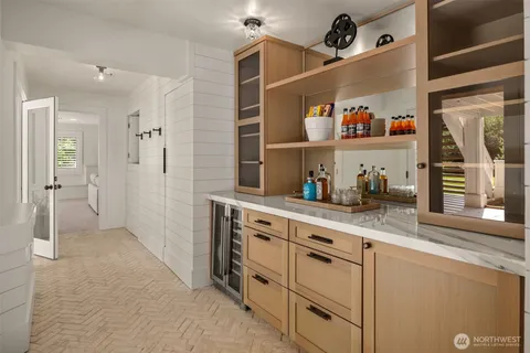 a kitchen with cabinets and window