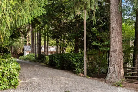 a view of a house with large tree