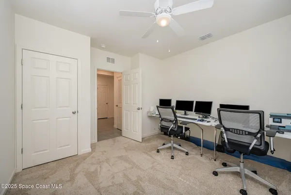 a view of a workspace with furniture