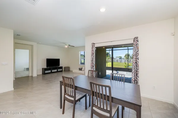 a view of a livingroom with furniture and a flat screen tv