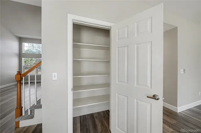 a view of walk in closet with empty racks
