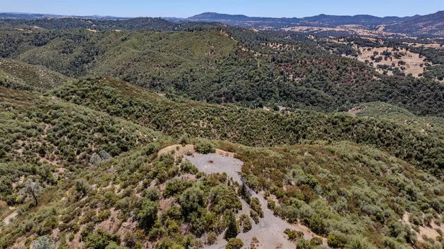 an aerial view of residential house and outdoor space