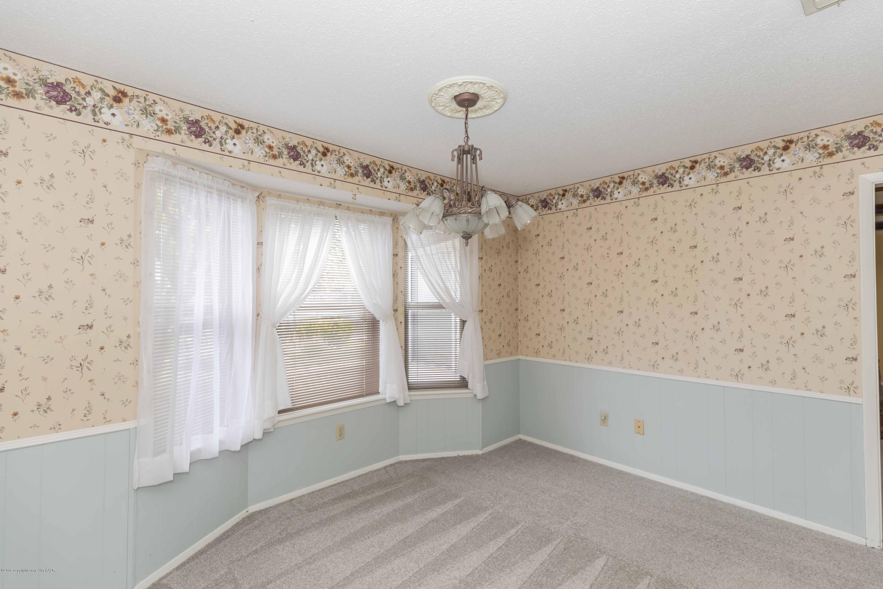 7206 Gainsborough Road Amarillo, TX 79106 - Photo 9 of 41 a view of an empty room with a window
