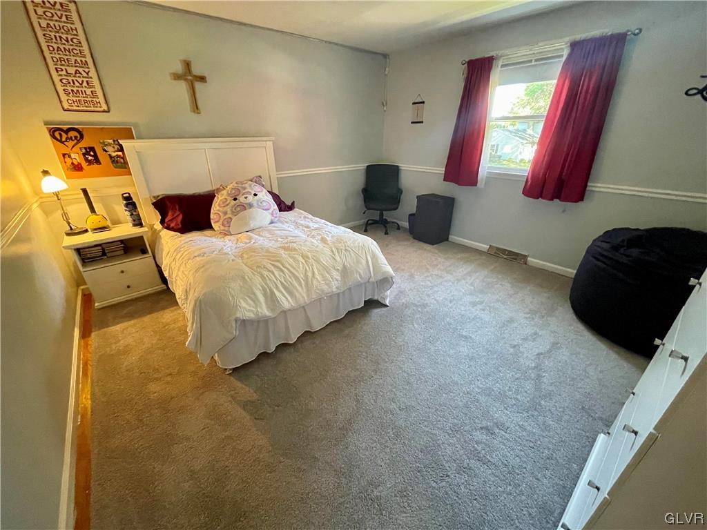 1295 Stark Road Bethlehem, PA 18017 - Photo 26 of 36 a bedroom with a bed and a mirror