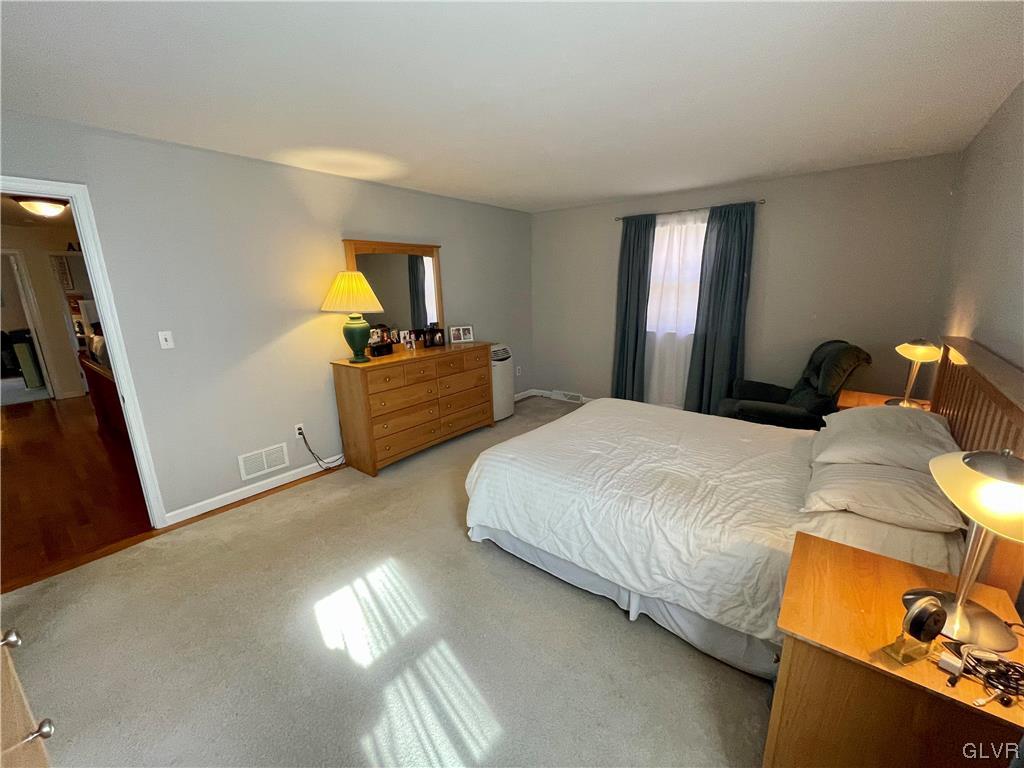 1295 Stark Road Bethlehem, PA 18017 - Photo 29 of 36 a bedroom with a bed and wooden floor