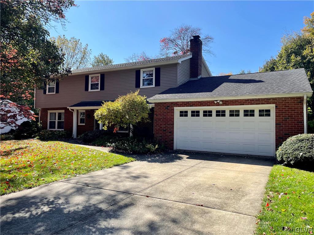 1295 Stark Road Bethlehem, PA 18017 - Photo 3 of 36 a front view of a house with a yard and garage