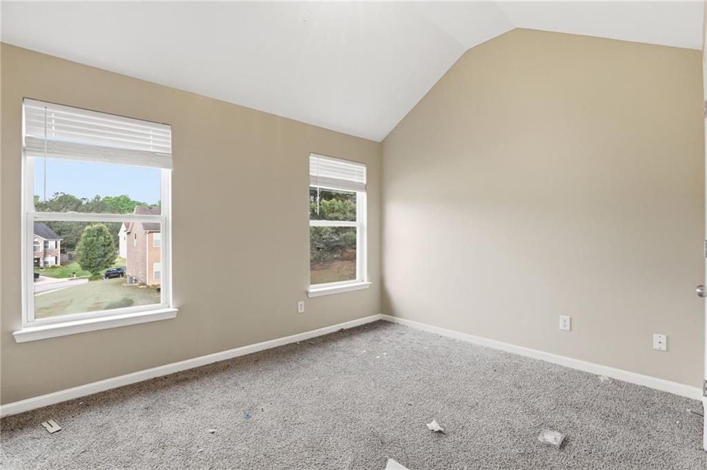 4968 Locherby Drive Fairburn, GA 30213 - Photo 27 of 39 an empty room with windows