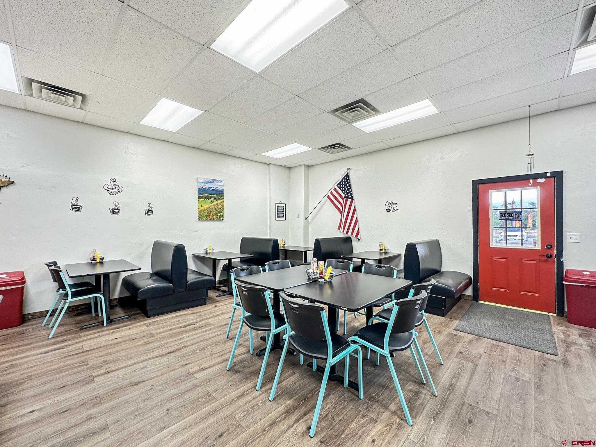 12840 Highway 65 Eckert, CO 81418 - Photo 12 of 34 a view of a dining room with furniture wooden floor and furniture