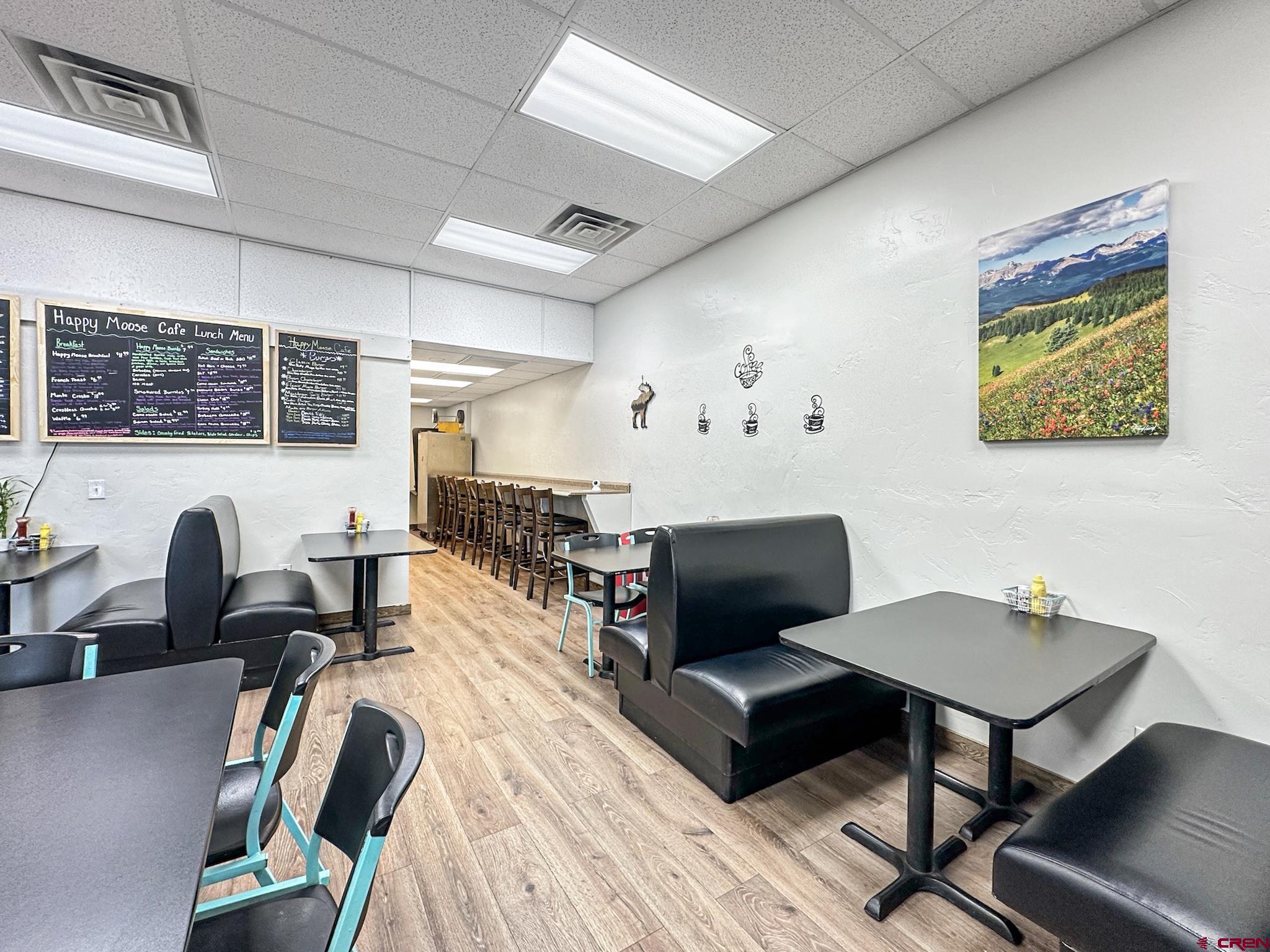 12840 Highway 65 Eckert, CO 81418 - Photo 14 of 34 a living room with furniture a rug and a computer