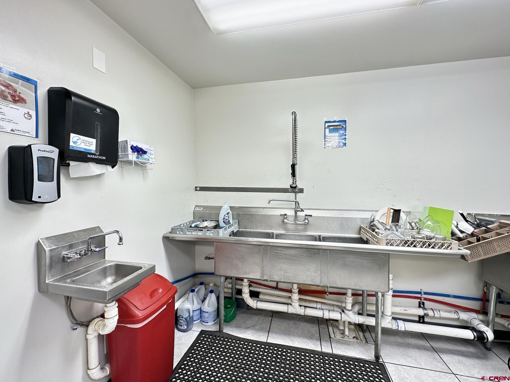 12840 Highway 65 Eckert, CO 81418 - Photo 18 of 34 a kitchen with stainless steel appliances a sink and a stove