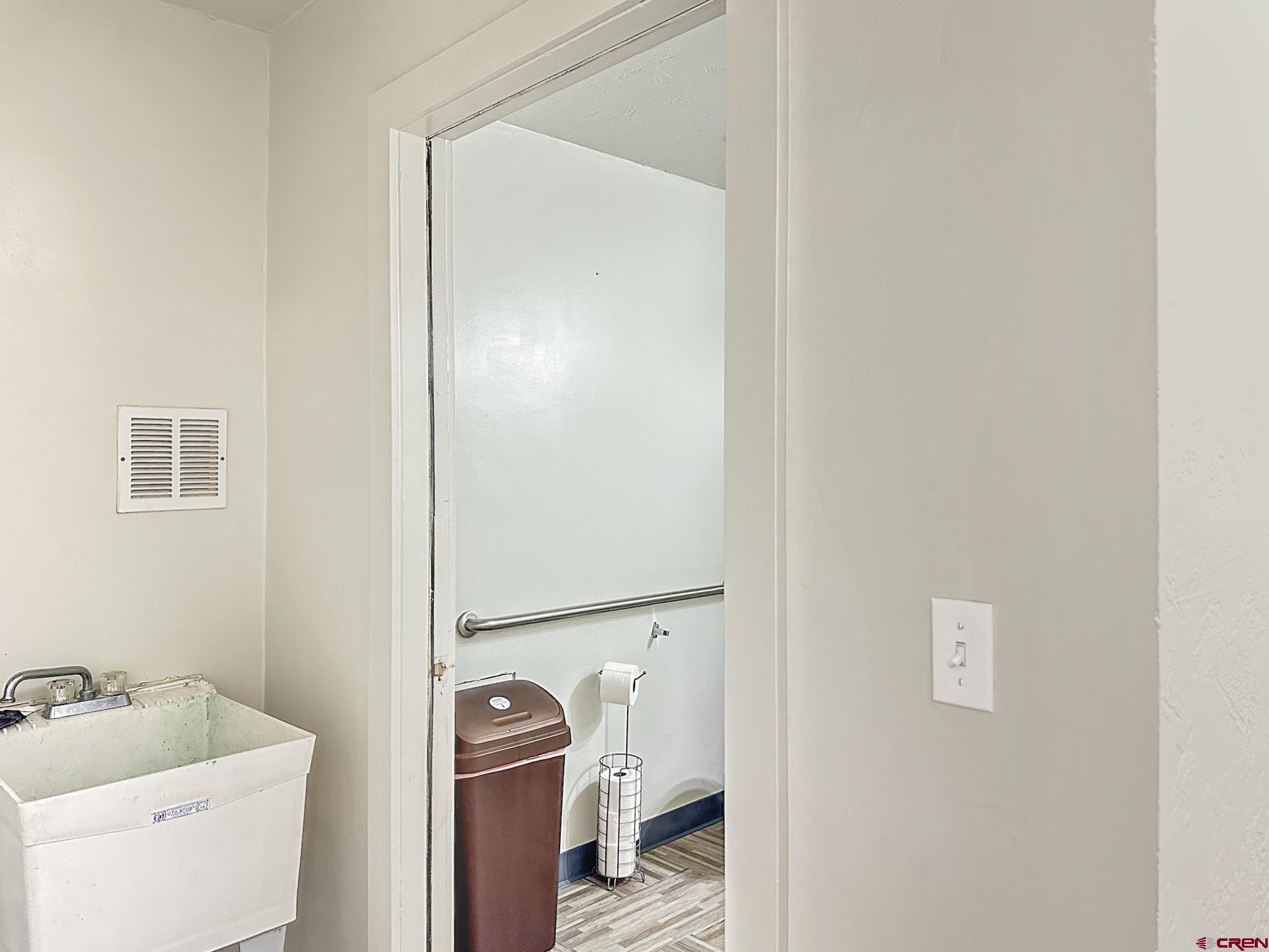 12840 Highway 65 Eckert, CO 81418 - Photo 20 of 34 a bathroom with a sink and a mirror