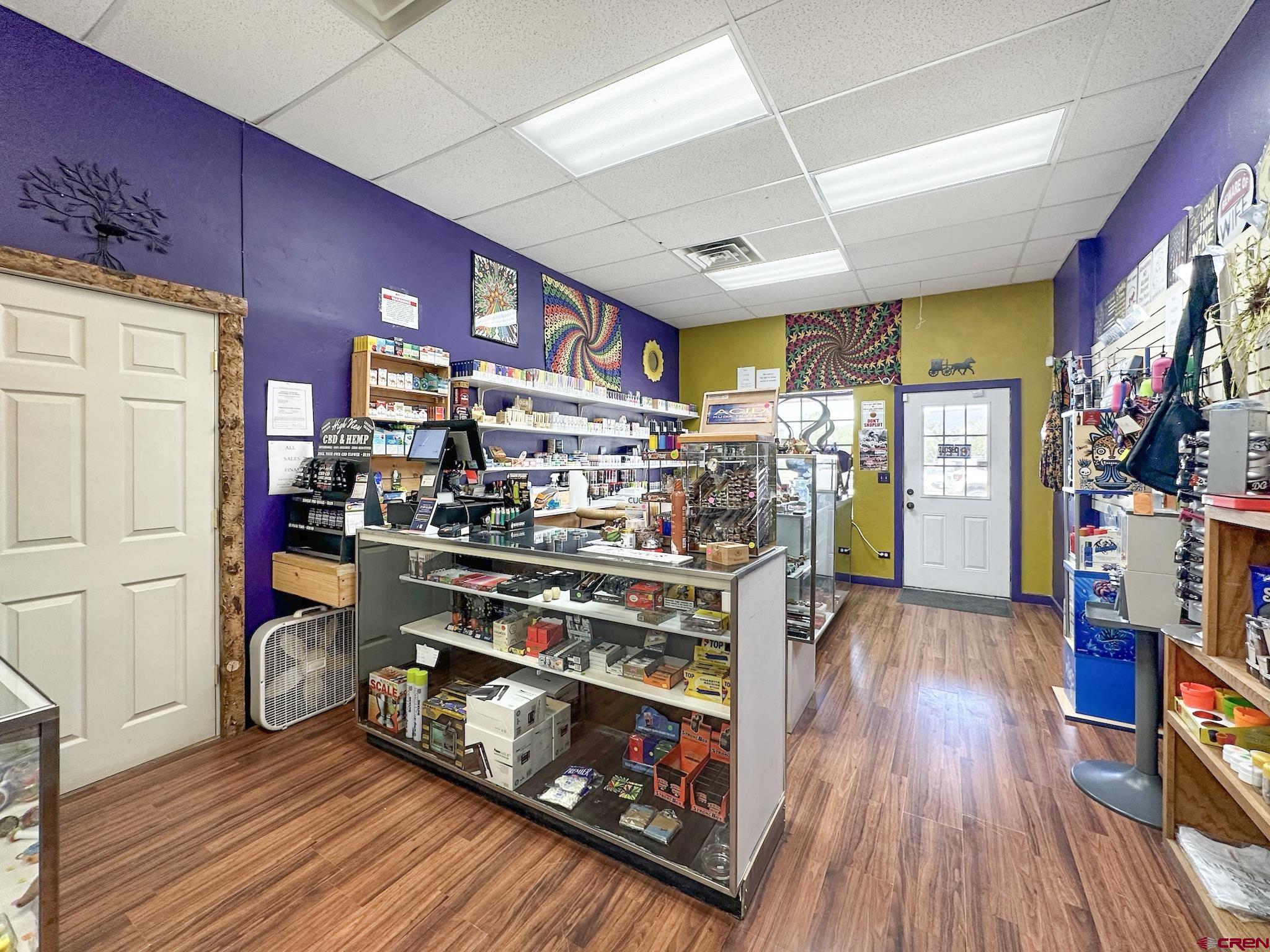 12840 Highway 65 Eckert, CO 81418 - Photo 24 of 34 a room with wooden floor and furniture