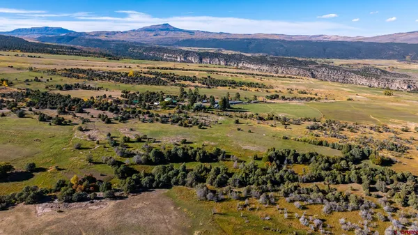 a view of an ocean and a mountain