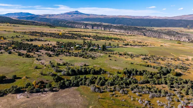 a view of an ocean and a mountain