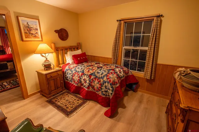 a bathroom with a sink mirror vanity and toilet