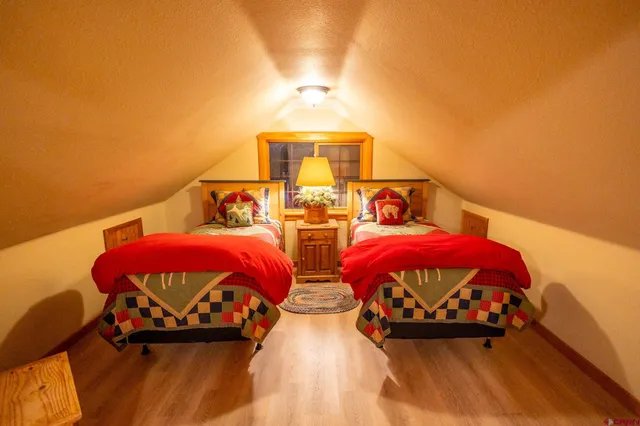 a view of a patio with table and chairs and potted plants
