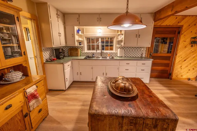 a kitchen with a sink and cabinets