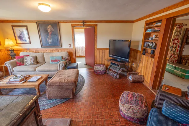 a room with a bed and a table in it