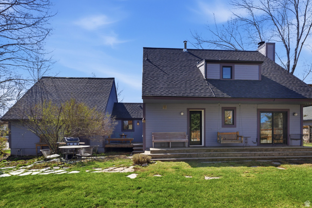 2635 Little Kate Road, Unit 21 Park City, UT 84060 - Photo 37 of 39 Rear view of house featuring a lawn, a porch, roof with shingles, and a chimney