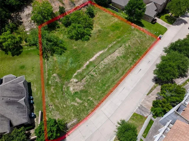a view of a garden from a balcony