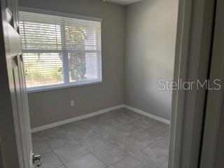 8934 Southwest 78th Court Ocala, FL 34476 - Photo 5 of 11 a view of an empty room with a window