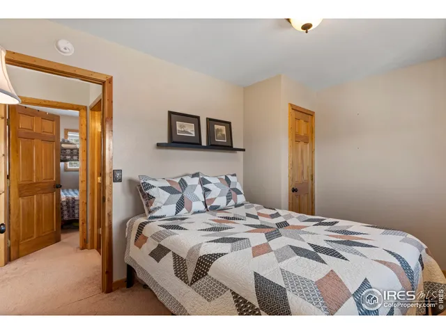 a bedroom with a bed and a tv