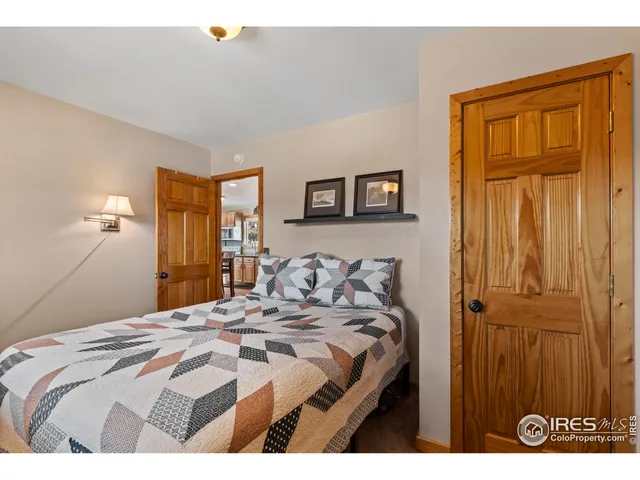 a bedroom with a bed and a table