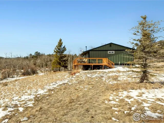 a big house with a big yard and large trees