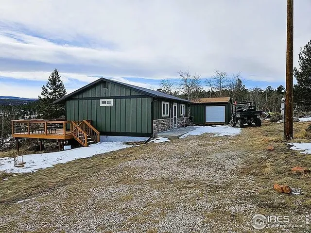 a view of a house with roof deck front of house