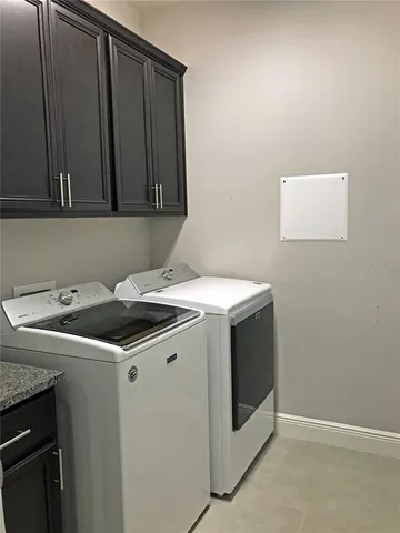 a kitchen with kitchen island a sink stainless steel appliances and cabinets