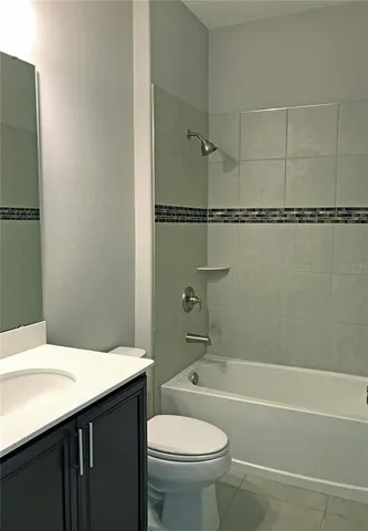 an empty room with a window and a ceiling fan