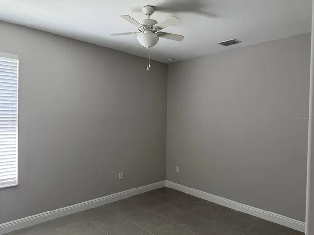 en empty room with windows