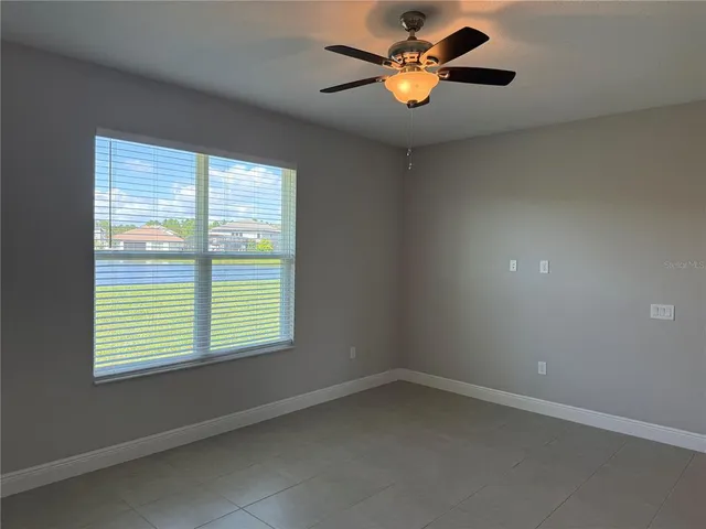 a view of storage and utility room with a window