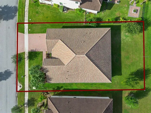 a view of a wooden deck with a yard