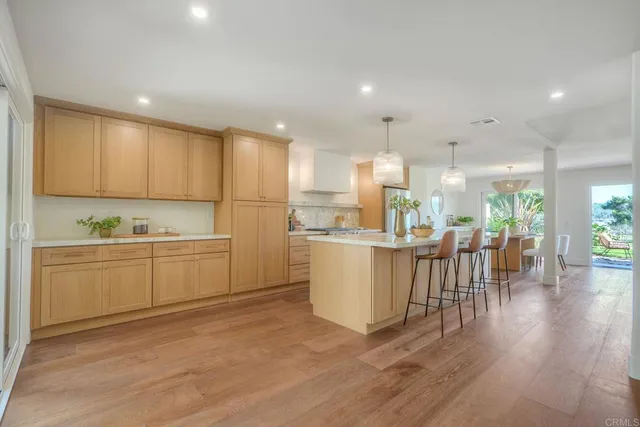 a kitchen with a white cabinets and counter space
